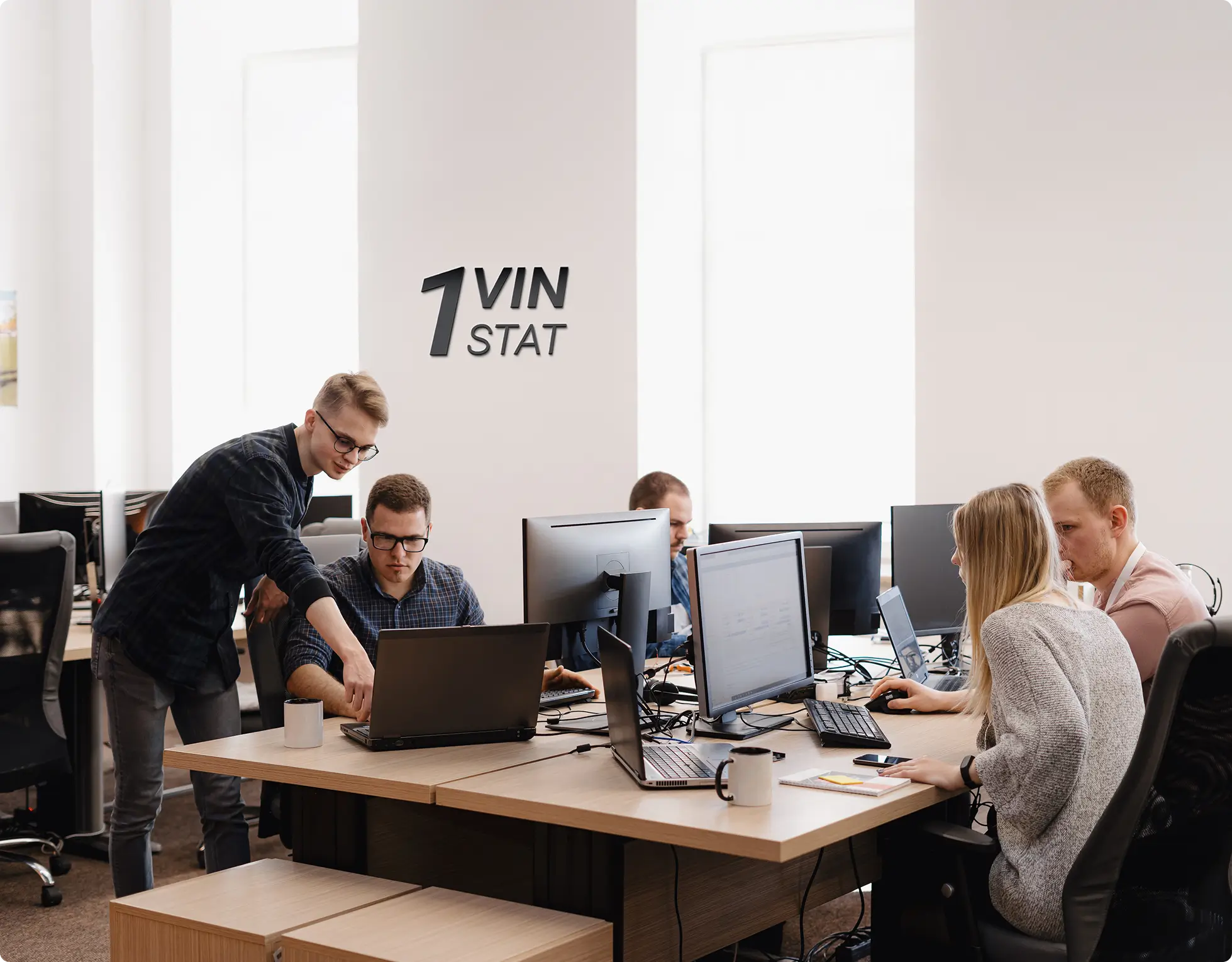 Stat.VIN Delivery operations team in the office
